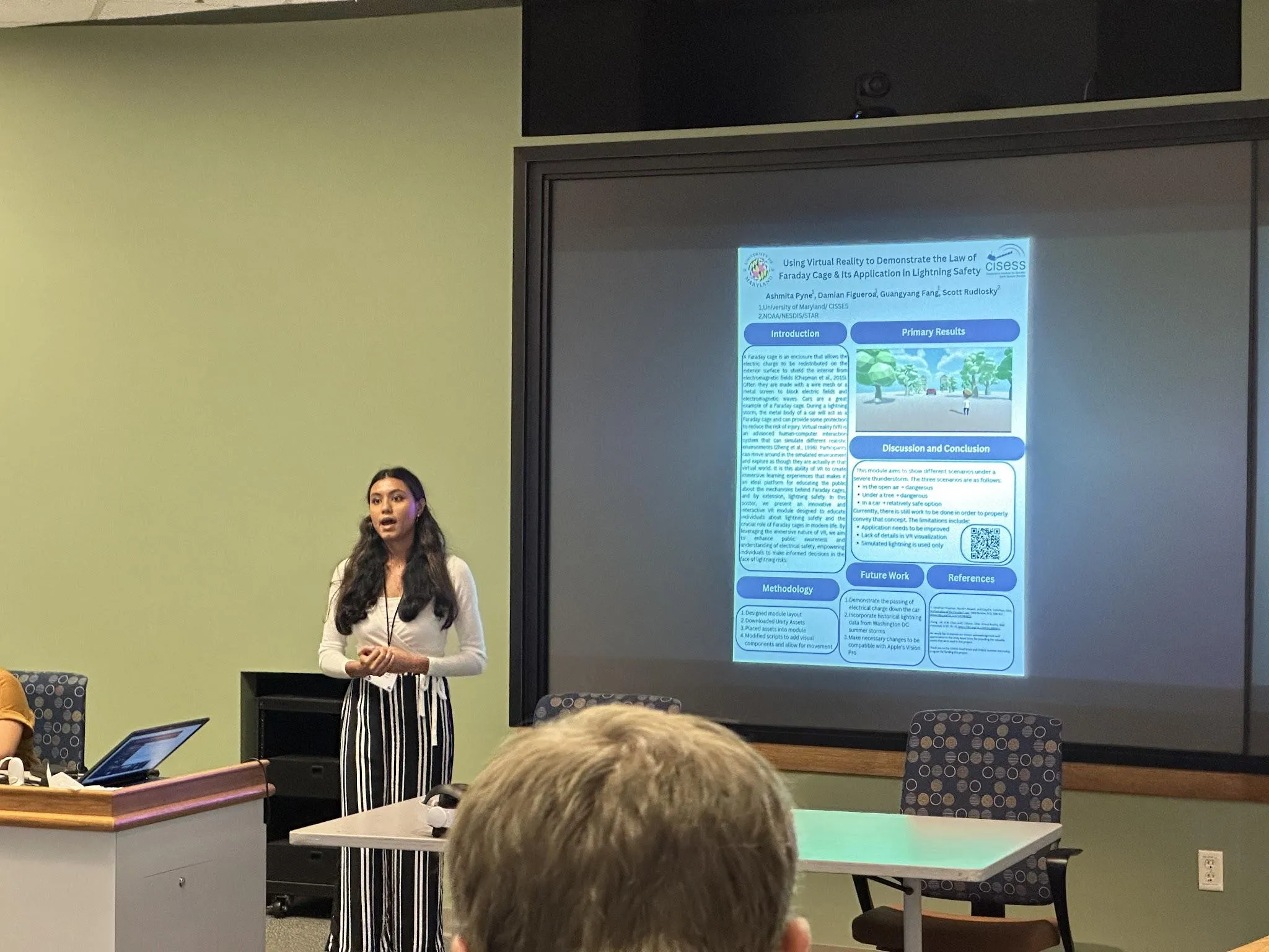 Ashmita presenting the Faraday Lightning Safety module poster.
