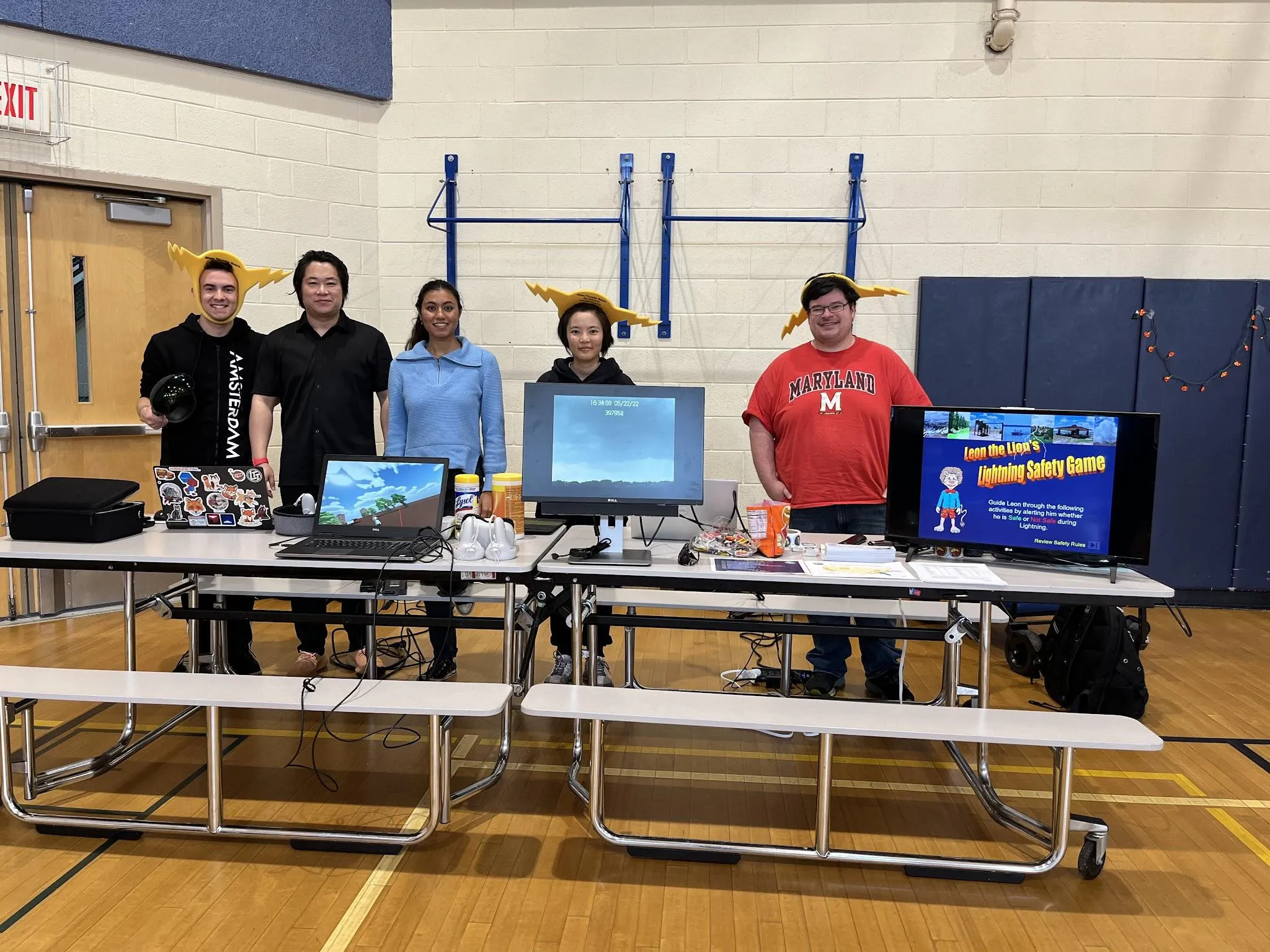D.J., Dr. Guangang Fang, Ashmita, Daile, and Joseph at the Spooky Mad Science Expo 2023.