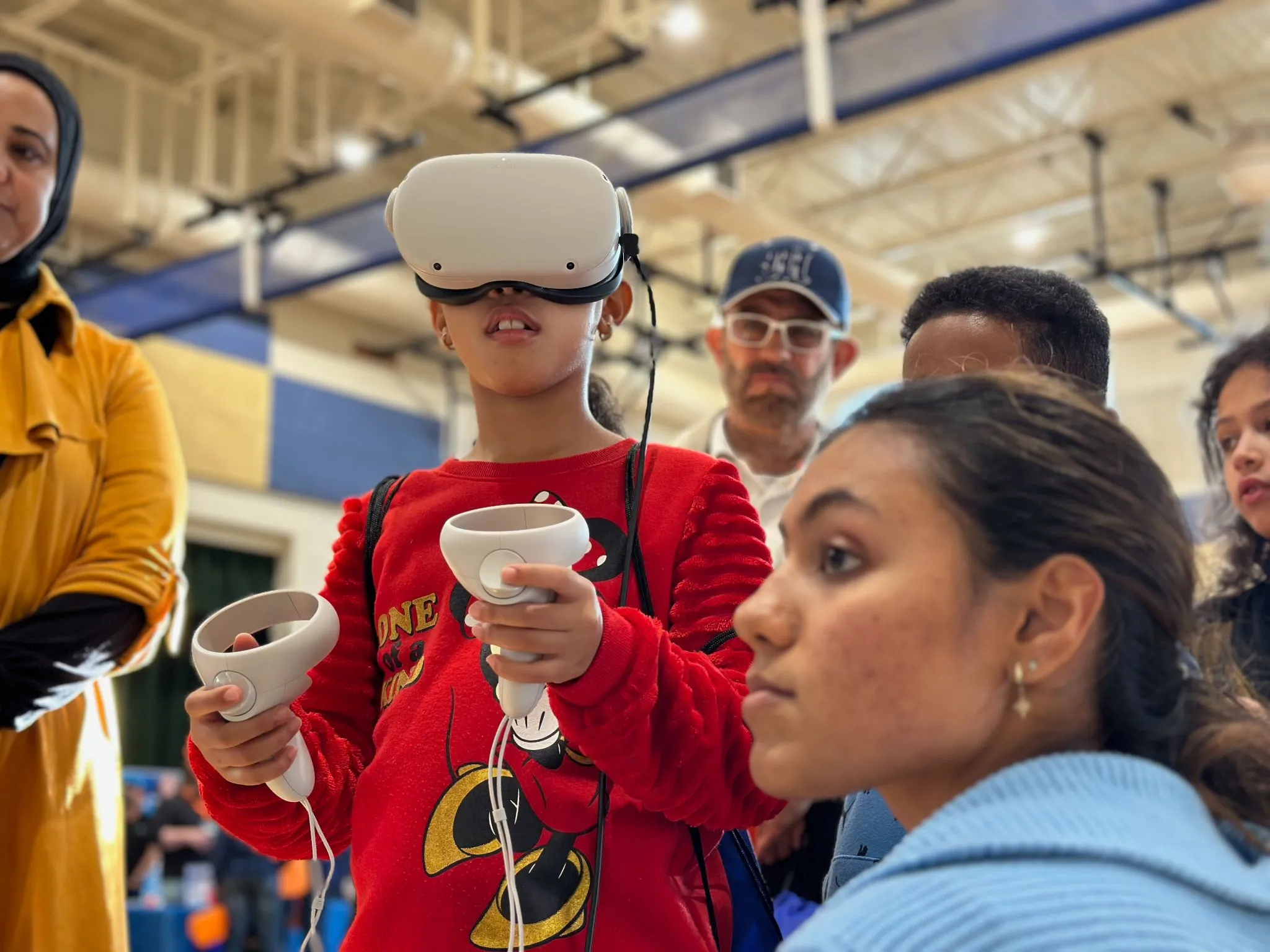Ashmita guiding a small girl through her Faraday Lightning Safety module.