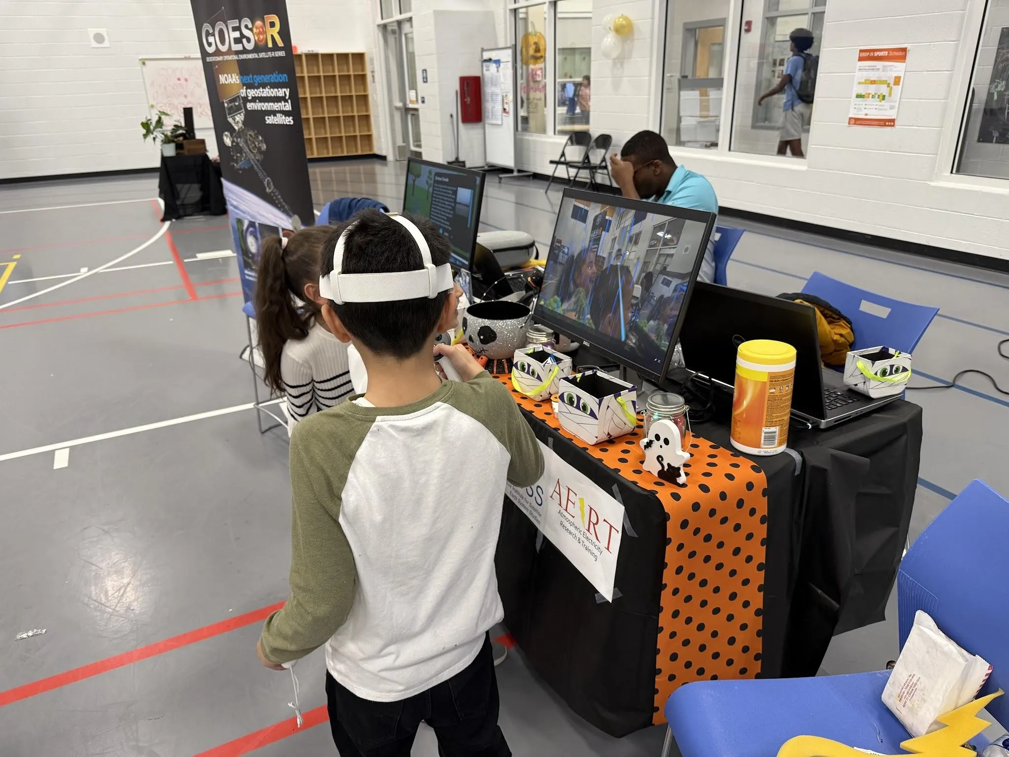 A group of children playing Faraday lightning safety.