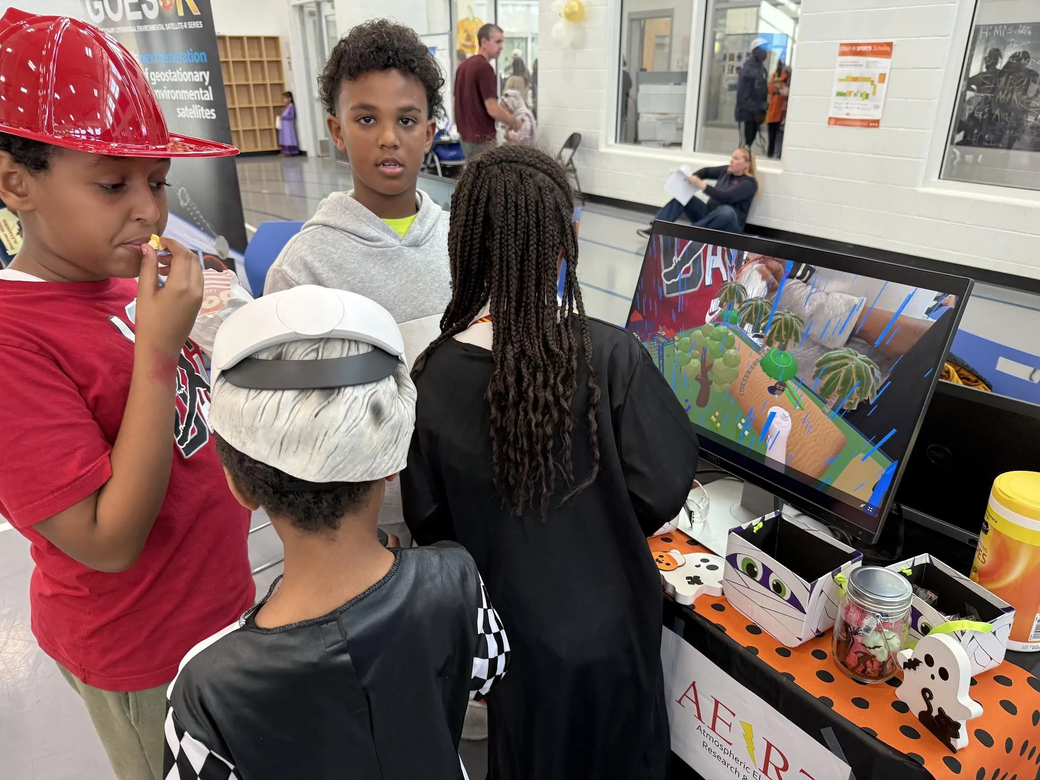 A group of children playing Faraday lightning safety.